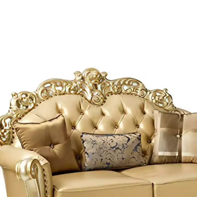 Divanetto 2 posti color osso in similpelle con patina oro, capitonné